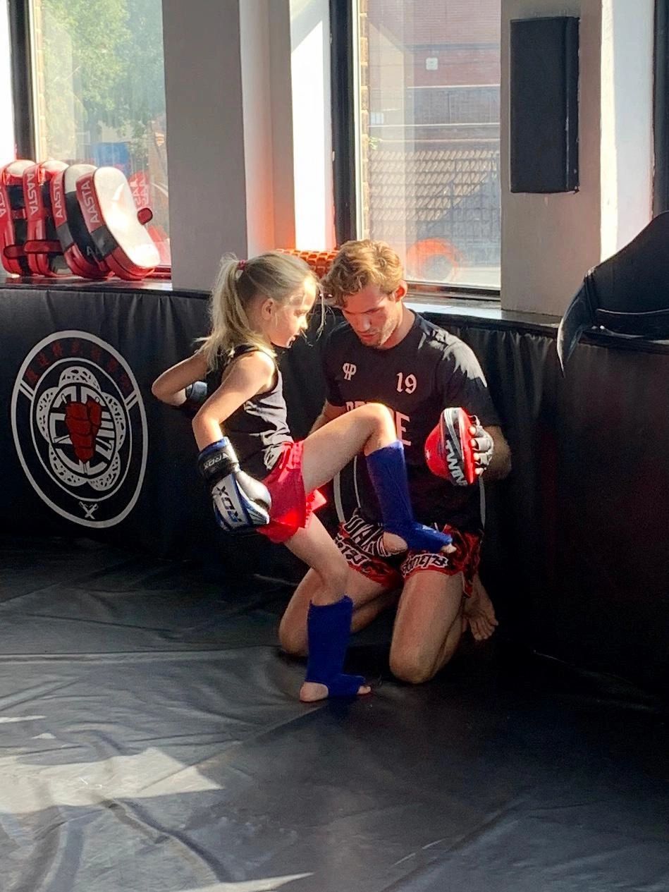 Muay Thai training session with pad work at Beckenham Boxing Club